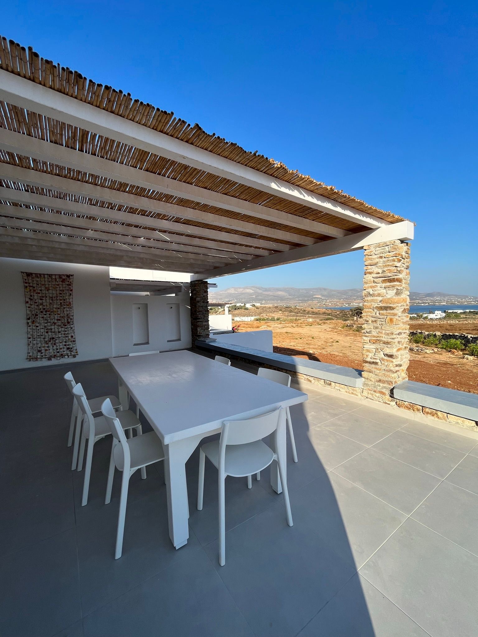 House 5 terrace dining with sea view