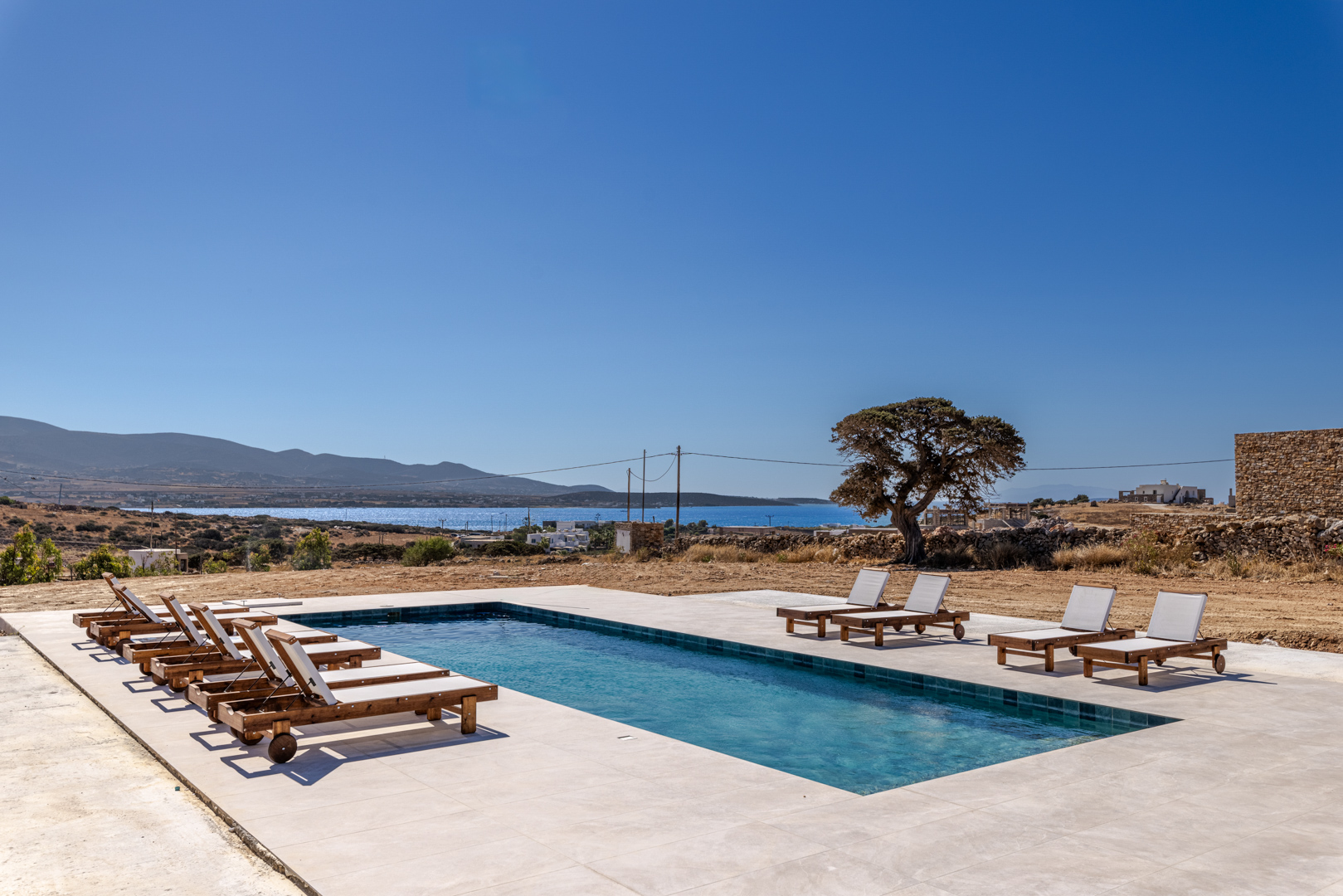 Pool with stone wall — Antiparos Houses